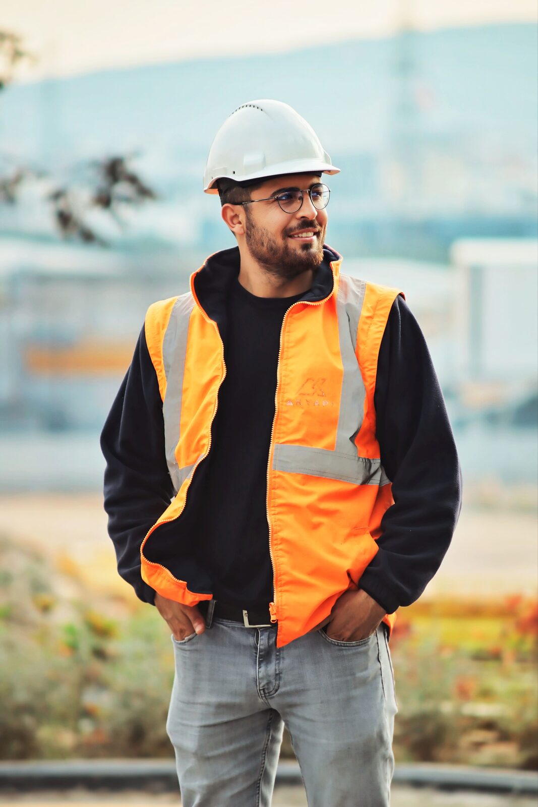 A construction worker in safety gear outdoors